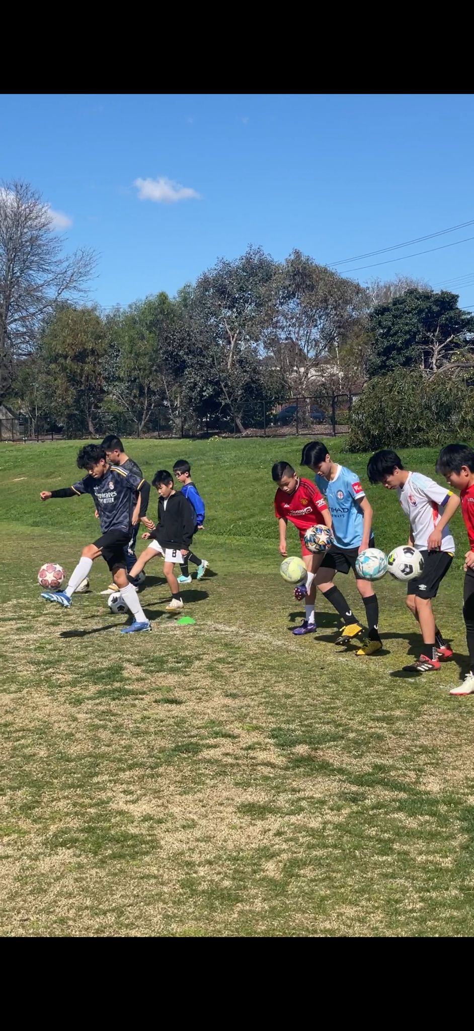 Elevate Football Academy group of players practicing ball skills