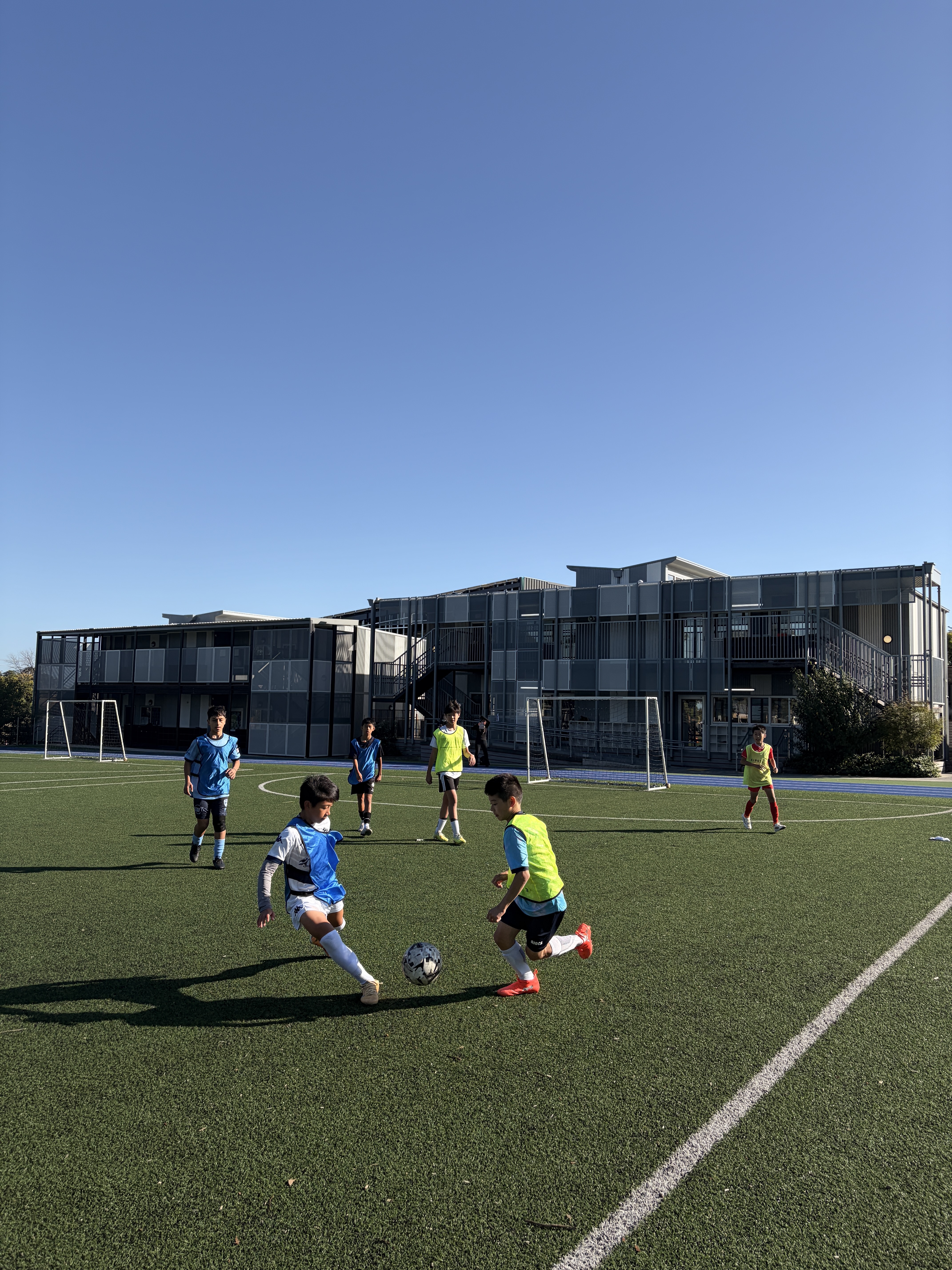 EFA players training in a small-sided match at Kew High School